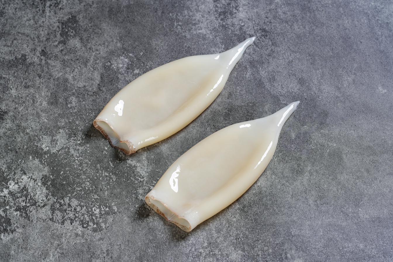 Illex Cleaned Tube — skin-off, gutted, two specimens shown